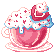 a transparent pink teacup with whipped cream, heart sprinkles, and a strawberry on top